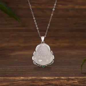 Detailed view of a silver necklace featuring a white Laughing Buddha pendant with stones.