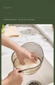 Close-up of rice washing basket with ergonomic handle for easy one-hand operation.