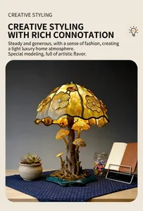 Detailed view of mushroom-shaped resin lamp with glowing yellow glass shade on desk