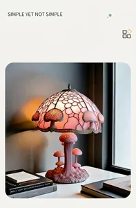 Detailed view of pink magic LED mushroom lamp with artistic stained glass shade
