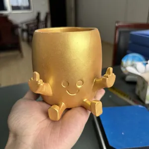Funny gold resin planter with middle finger gesture and smiley face for home decor