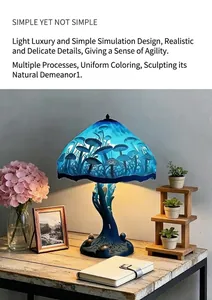 Detailed view of a magical blue mushroom LED lamp with resin base on a rustic wooden desk