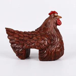 Detailed side view of a resin rooster figurine designed for garden fence decoration