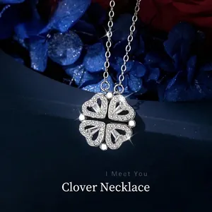 Macro detail of S925 silver necklace with a sparkling four-leaf clover heart pendant