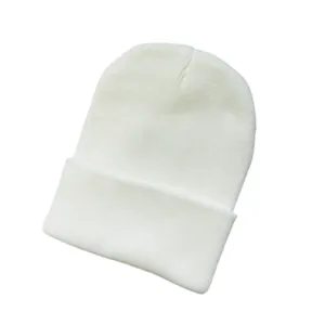 Close-up of white knitted solid color beanie with detailed ribbed texture