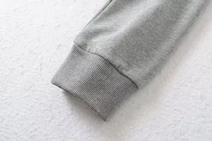 Detailed close-up view showing the ribbed cuff texture of a grey vintage zip-up sweatshirt jacket.