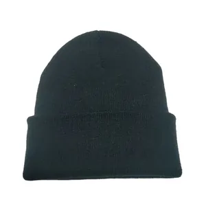 Detailed texture of basic black knitted beanie hat for autumn and winter warmth