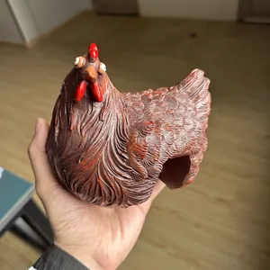 Detailed view of a rustic brown resin hen figurine designed for garden fence decoration