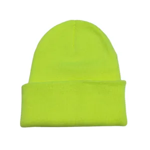 Close-up of neon green knitted beanie with folded cuff detail