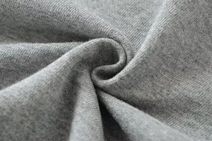 Macro view of high-quality gray cotton knit sweatshirt fabric texture and softness