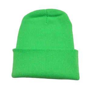 Vibrant neon green knit beanie hat with classic ribbed texture for winter warmth and style