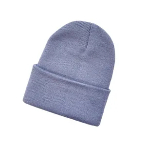 Close-up detail of a soft lavender purple knitted beanie hat with a folded cuff