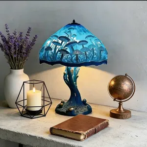Enchanting blue LED mushroom table lamp with resin base for a magical home decor