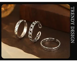 Detailed view of three vintage S925 silver stackable open rings with unique textures.