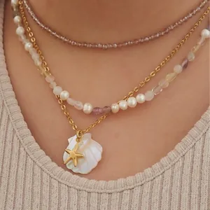 Layered summer beach necklace with gold starfish and white shell pendant in 18K gold plated