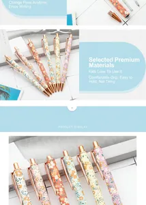 Close-up detail of floral pattern ballpoint pens with rose gold clips and press mechanism