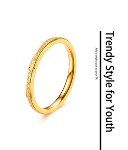 Close-up of golden titanium steel ring featuring a fine frosted sandblasted texture