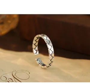 Detailed macro view of vintage S925 sterling silver open ring with braided texture