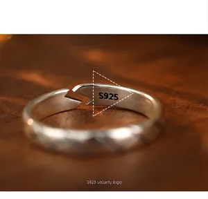 Close-up of S925 sterling silver open ring with vintage diamond pattern details