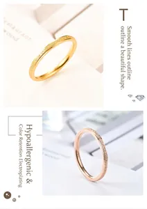 Close-up of frosted titanium steel rings in elegant gold and rose gold finishes.