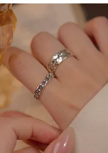 Detailed close-up showing the texture of S925 sterling silver retro stackable rings on a hand