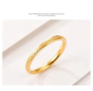 Macro view of a minimalist titanium steel frosted rose gold ring showing fine texture