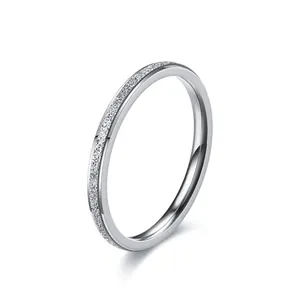Detailed macro view of a minimalist titanium steel ring with a frosted glitter texture