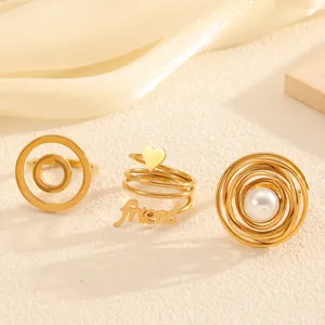 Elegant set of three vintage gold titanium steel rings with pearl and heart designs