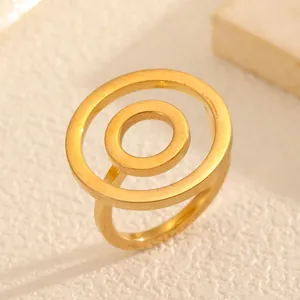 Minimalist gold titanium steel ring featuring a unique double circle orbital design.