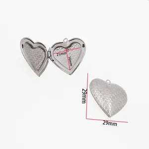 Close-up of heart-shaped stainless steel locket with 29mm dimensions and scale pattern.