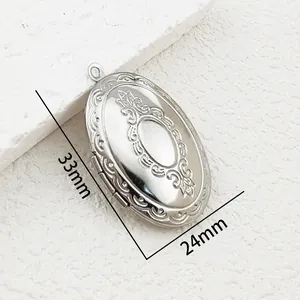 Detail shot of a vintage oval stainless steel photo locket with 33mm x 24mm dimensions
