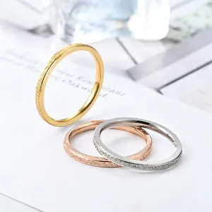 Simple frosted titanium steel rings for women in gold, silver, and rose gold finishes.