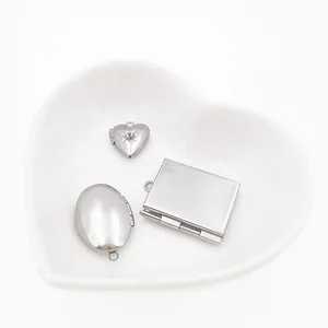 Variety of DIY stainless steel photo locket pendants in heart, oval, and square shapes
