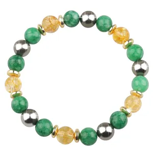 Close-up detail of natural stone bracelet featuring green turquoise and silver magnetic beads