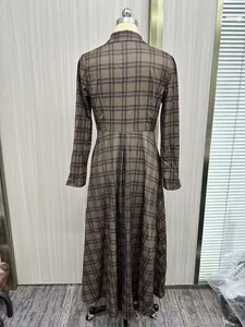 Detailed back view of a vintage plaid print long-sleeve maxi shirt dress shown on mannequin