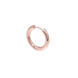 Detailed macro view of a minimalist rose gold stainless steel hoop earring for women