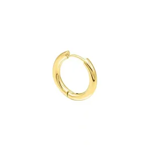 Macro detail view of a highly polished gold-finish circular stainless steel hoop earring