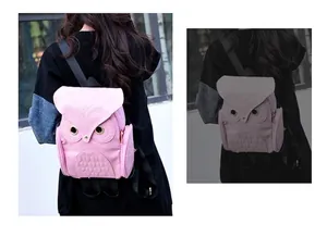 Close-up detail of a pink owl-shaped cartoon backpack worn by a female model outdoors