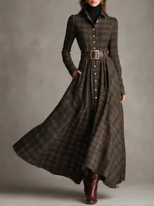 Detailed look at an elegant plaid shirt maxi dress with a leather belt on a model