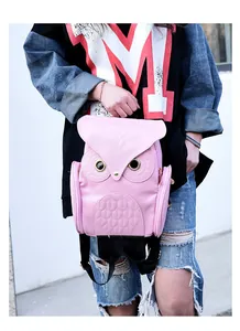 Detail of a pink owl-shaped backpack for women featuring a 3D cartoon design for travel