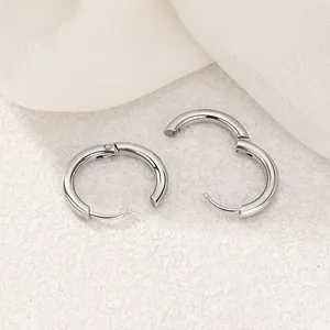 Detailed view of silver stainless steel hoop earrings with secure clasp mechanism
