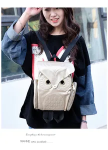Detailed view of stylish 3D owl backpack with metallic finish on a model