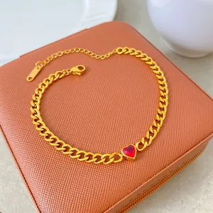 Detailed view of gold-plated titanium steel chain with a red heart zircon pendant.