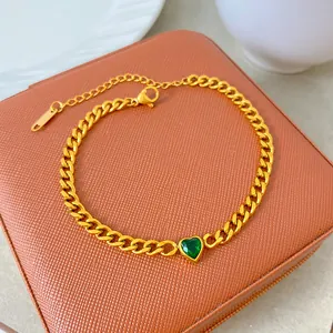 Detailed view of a gold-plated titanium steel necklace with a green heart zircon.