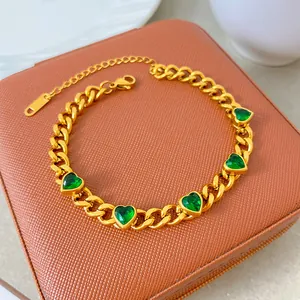 Detailed view of a gold-plated titanium steel necklace featuring green heart zircons