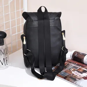 Detailed back view of a black Korean-style owl backpack with adjustable straps