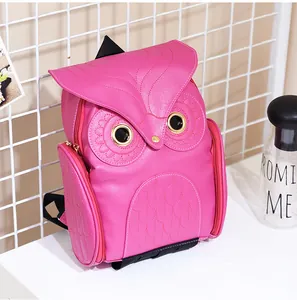 Vibrant pink owl-shaped backpack with decorative stitching and metallic eye details.