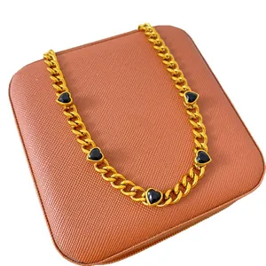 Elegant gold plated titanium steel chain necklace featuring five black heart zircon charms