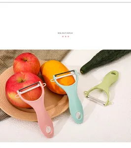 Multifunctional vegetable and fruit peelers in pastel colors shown with fresh produce