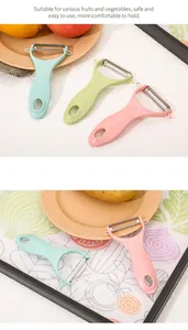 Close-up detail of multi-colored ceramic vegetable peelers showing the ergonomic handle design